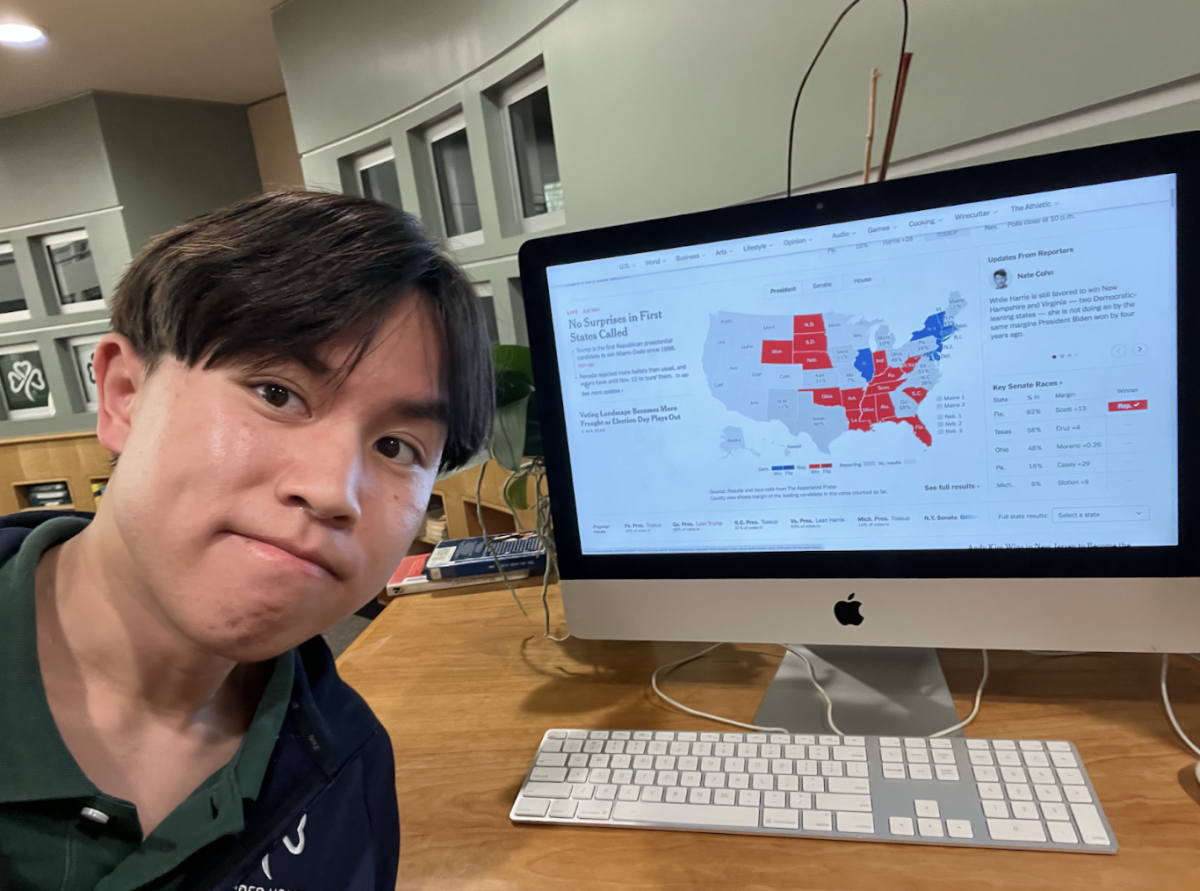 Jonah Lei ‘25 takes a selfie with the SHC library computer as the results come in on Election Night.